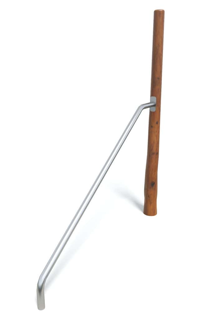 - durable outdoor handrail with wooden post and metal support for safety.